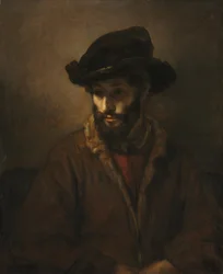 Un homme barbu portant un chapeau
