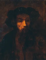Un homme barbu avec une casquette