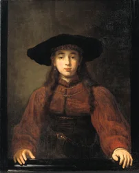 Une jeune femme reposant ses mains sur le cadre du tableau