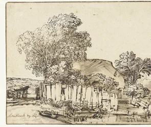 Cottage avec palissade blanche parmi les arbres
