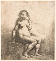 Femme nue assise sur un monticule