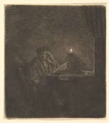 Étudiant à une table à la lumière d
