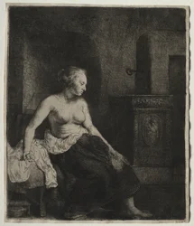 Femme assise à moitié habillée près d