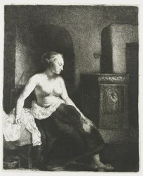 Femme assise à moitié habillée près d