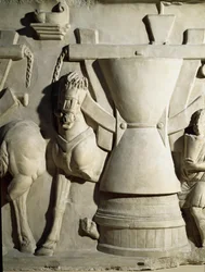 Art romain : bas-relief représentant une roue de moulin. Ier siècle ap. J.-C. Rome, Museo della Civiltà Romana