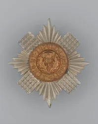 Insigne de casquette, vers 1896-1920 (métal)