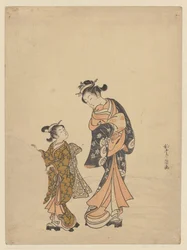 Jeune femme et fille avec boule de neige