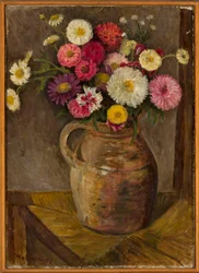 Asters et zinnias dans une cruche en terre cuite