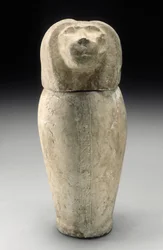 Vase canope à tête de cynocéphale (calcaire)