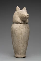 Vase canope à tête de chacal (calcaire)