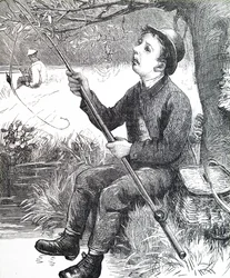 Un jeune garçon pêchant