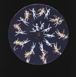 Disque de phénakistiscope montrant un cupidon et deux filles, vers 1830