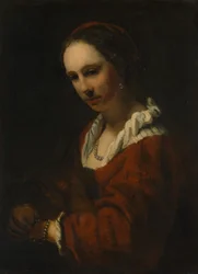 Jeune femme avec un collier de perles
