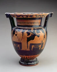 Krater à colonnes attique à figures rouges avec une scène de symposium d