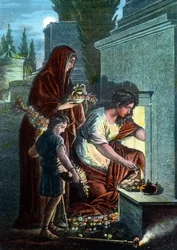 Des pleureurs faisant des sacrifices sur la tombe de leurs bien-aimés dans la zone des catacombes à Rome, Italie