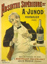 Un homme assis à une terrasse de bistrot éclate de rire en buvant un verre d