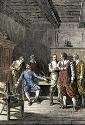 États-Unis, Massachusetts : Dispute entre John Winthrop (1588-1649) et Thomas Dudley (1576-1653) dans la colonie de la baie du Massachusetts. Gravure en couleur du XIXe siècle.