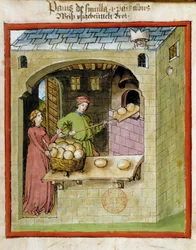 Fabrication du pain : un boulanger cuit les pains. Enluminure du "Tacuinum sanitatis"