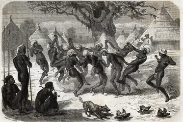Danse de bienvenue par les femmes de la tribu, au retour de Baker et de sa femme du lac Albert (Albert Nyanza). Gravure pour illustrer le voyage au lac Albert, en 1861-1864, de Sir Samuel White Baker, dans Le tour du monde, nouveau journal des voyages