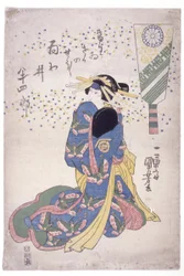 Femme agenouillée en robe bleue
