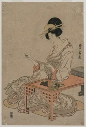 Courtisane assise à une table d
