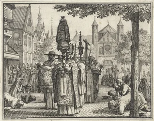 Procession avec une statue dans une rue