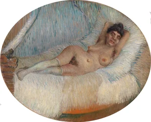 Femme nue étendue sur un lit