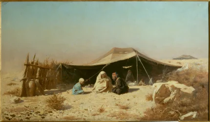 Arabe dans le désert lisant le Coran