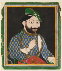 Homme barbu portant un turban vert