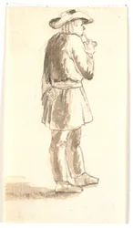 Homme debout fumant une pipe