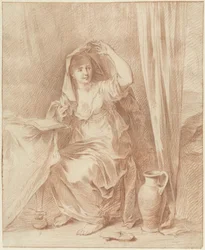Femme assise à une table avec un livre