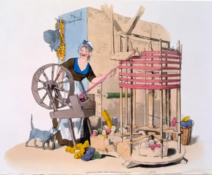 Femme filant de la laine sur une machine rotative pour faire des écheveaux