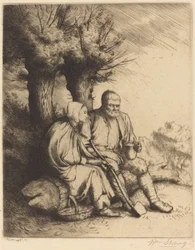 Homme et femme sous un arbre
