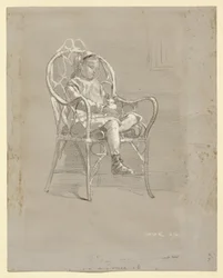 Enfant assis dans un fauteuil en osier