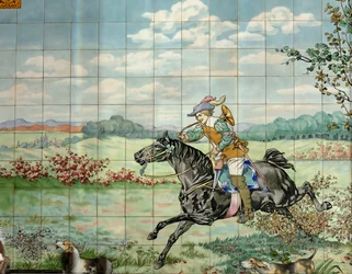 Vue intérieure, panneau de carreaux, peintre Furcy Ernest Tondeur, exécutant Boch Frères La Louvière, le deuxième panneau montre une scène de chasse avec un cavalier galopant avec un cor de chasse