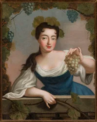 Femme avec une grappe de raisin